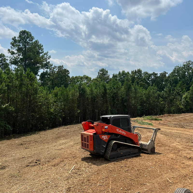 Explicit Land & Tree crew brush hogging an overgrown Georgia field