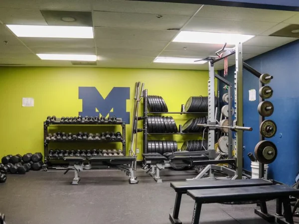 Gym weight training area with racks and equipment at Fieldhouse Training Center