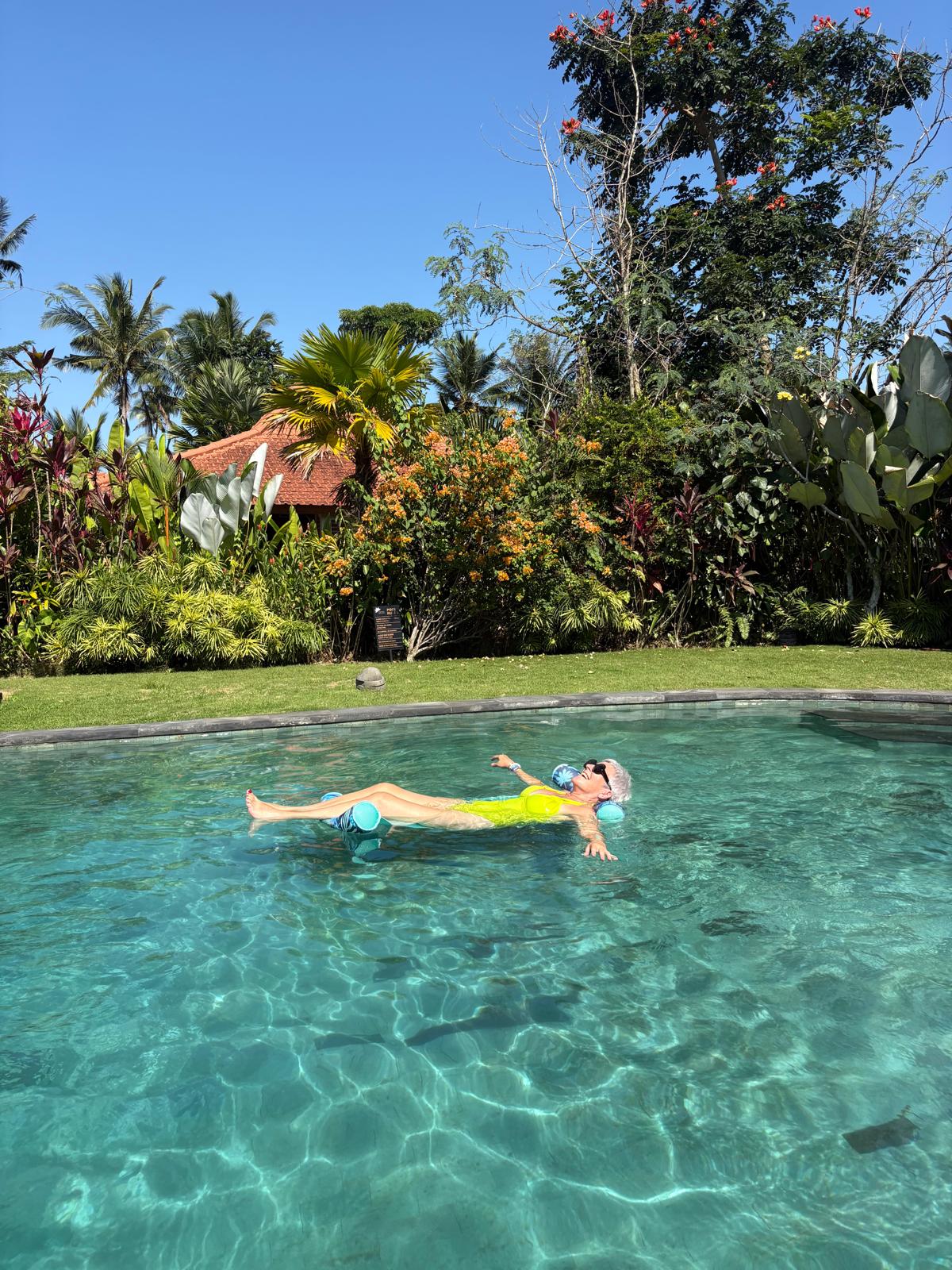 A guest floating in the pool