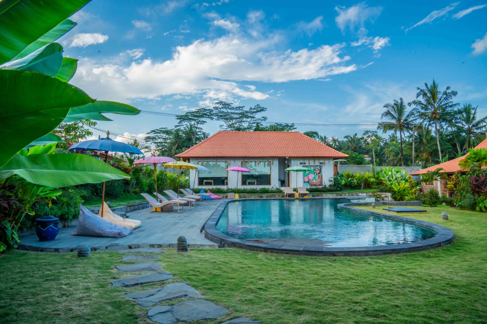 The pool and gardens at Kampung Uma Dawa
