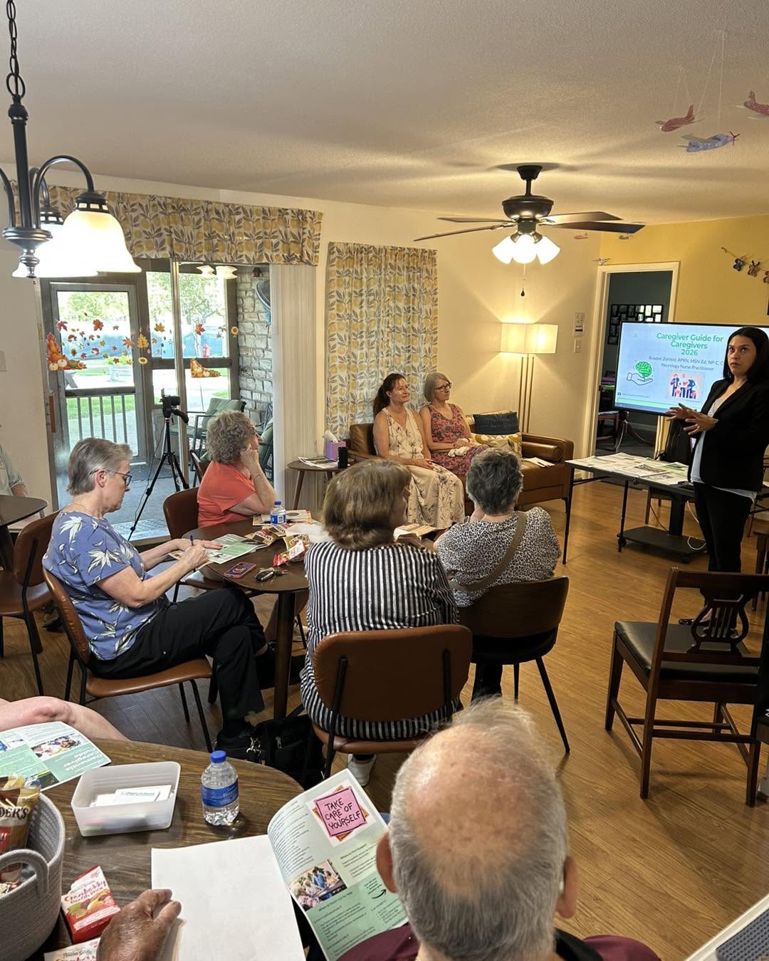 Caregivers attending an educational presentation at DEC
