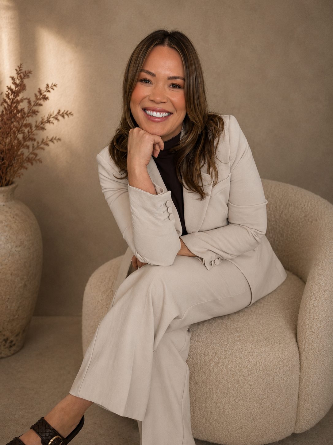 Renae Duval Usher, founder of Retail Media Commons, seated in a cream suit