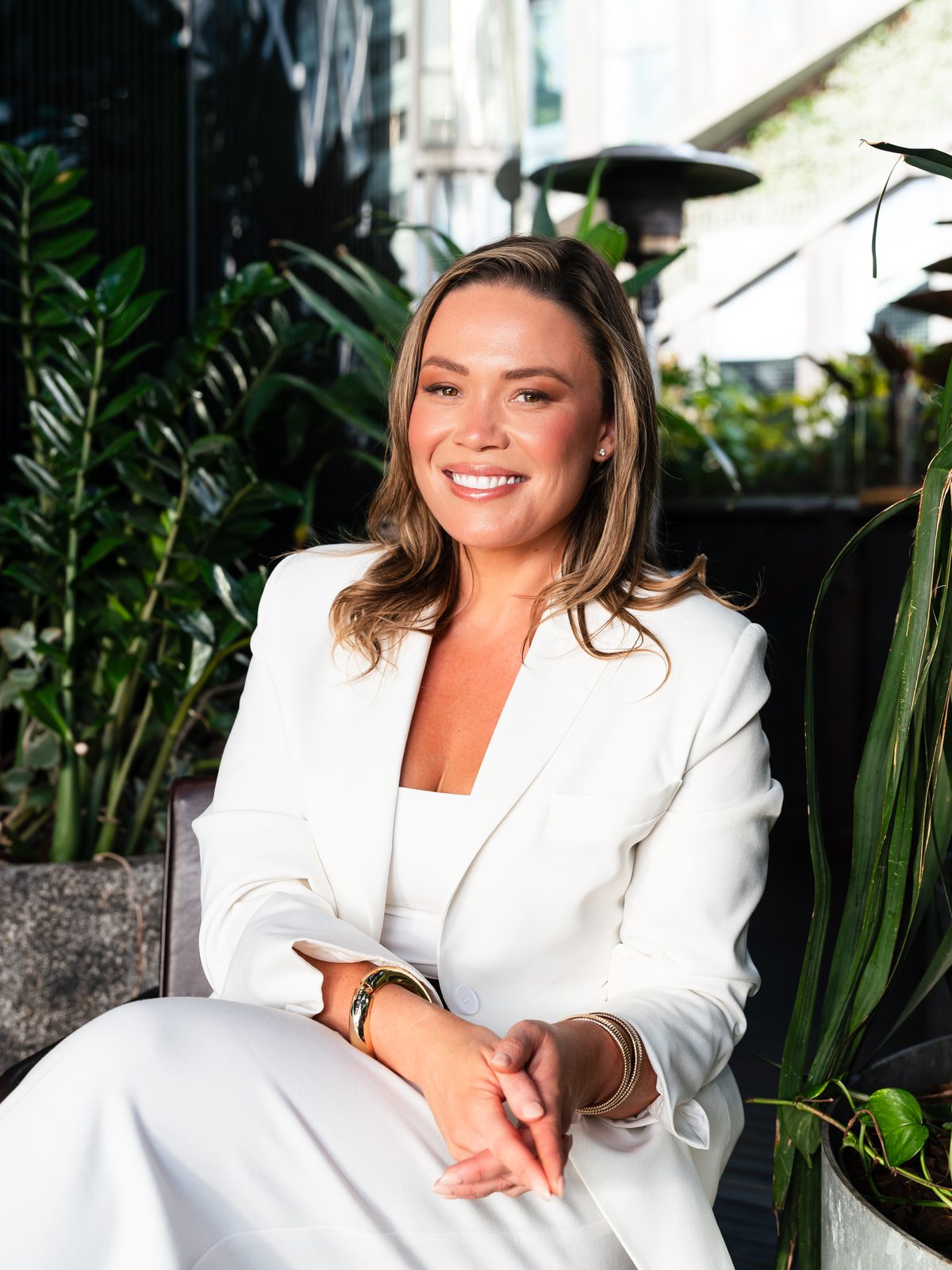 Renae Duval Usher, founder of Retail Media Commons, seated in a white suit