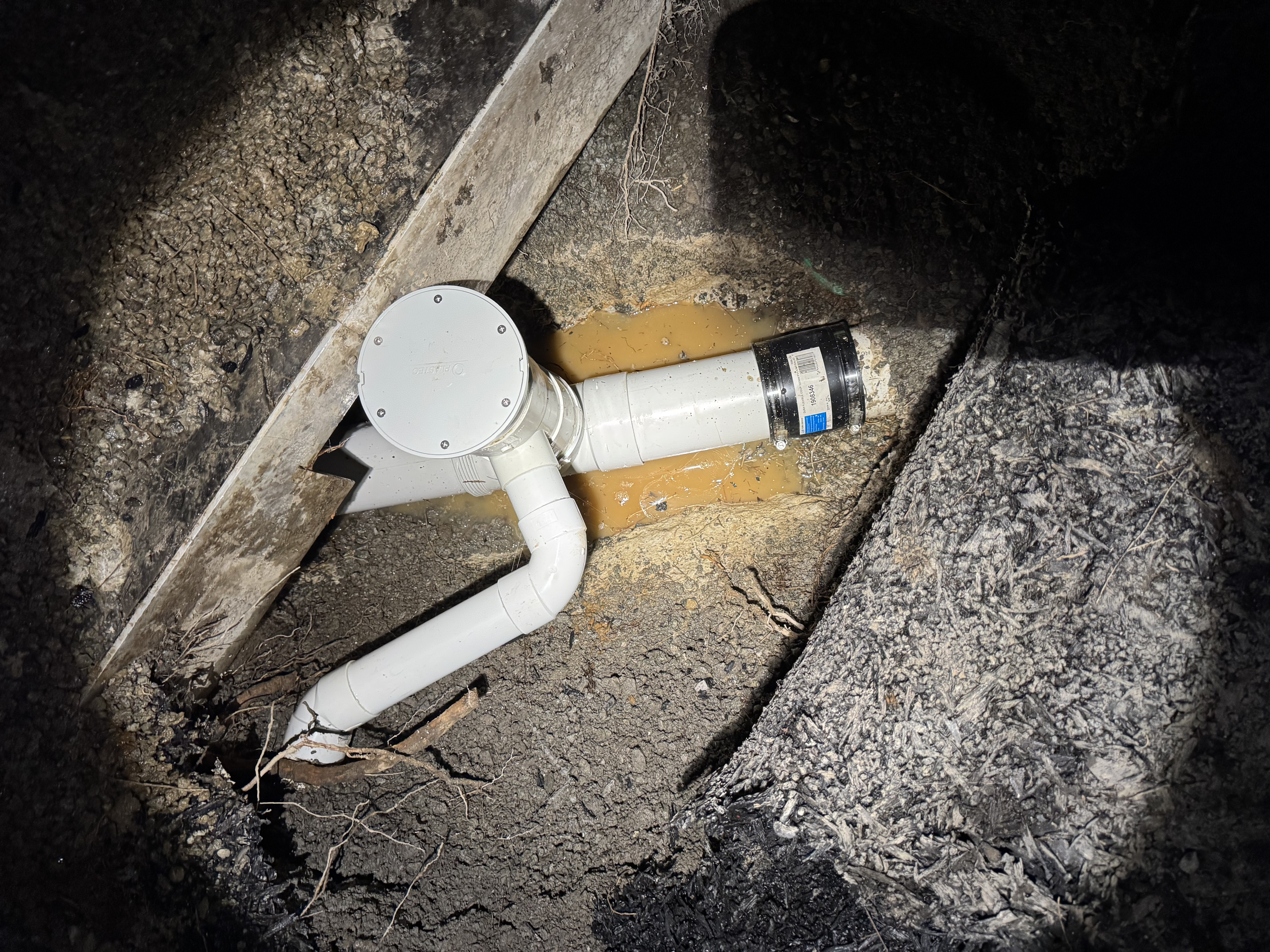 Underground drainage pipework exposed during repair work