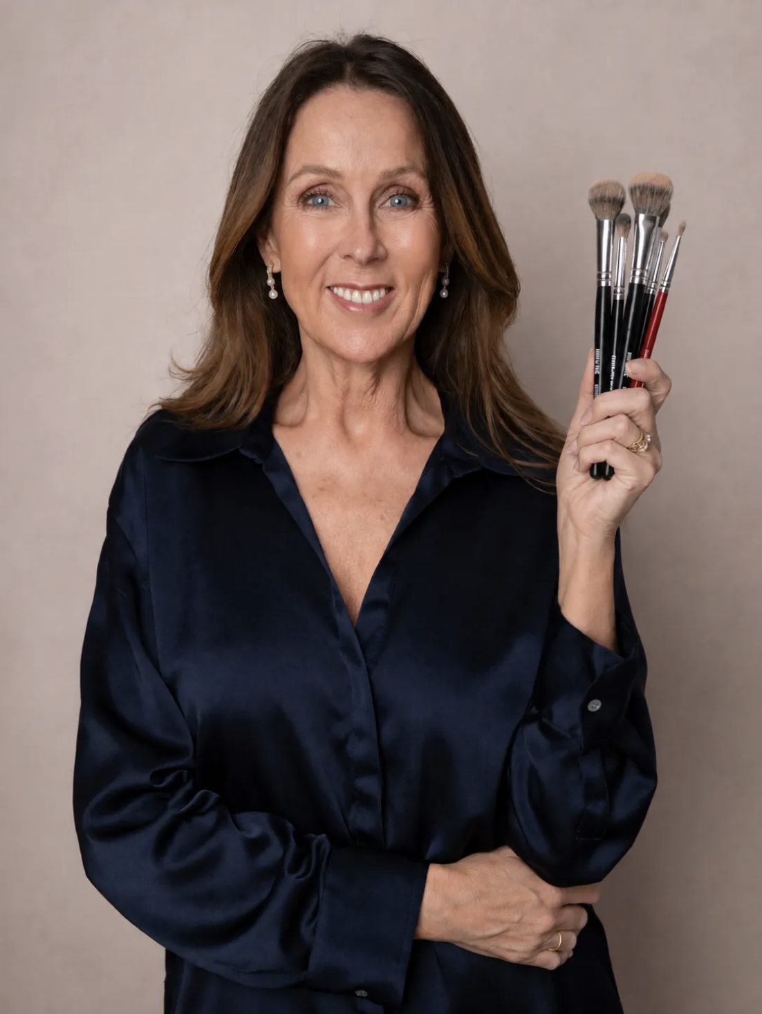 Sue Blackhurst holding her makeup brushes