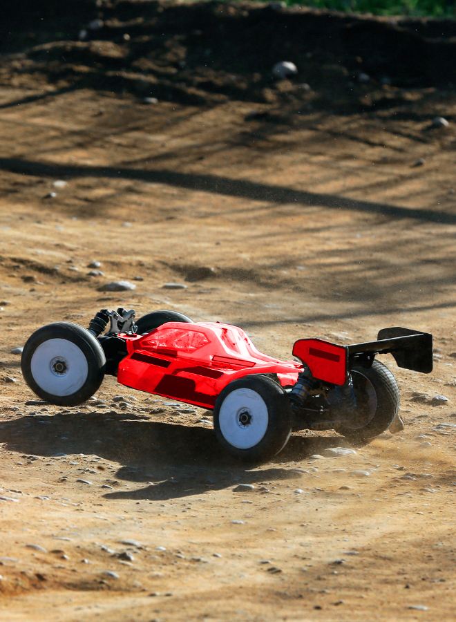 Electric RC buggy racing on a high-speed indoor track at 400 Indoor RC Raceway in Barrie.