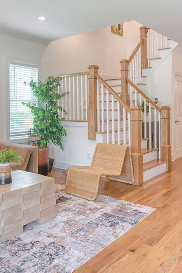 woman setting sheets on bed