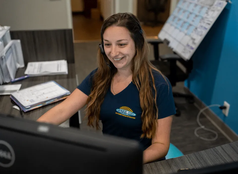 Total Air Inc. customer service representative assisting a homeowner with AC repair scheduling in St. Petersburg FL