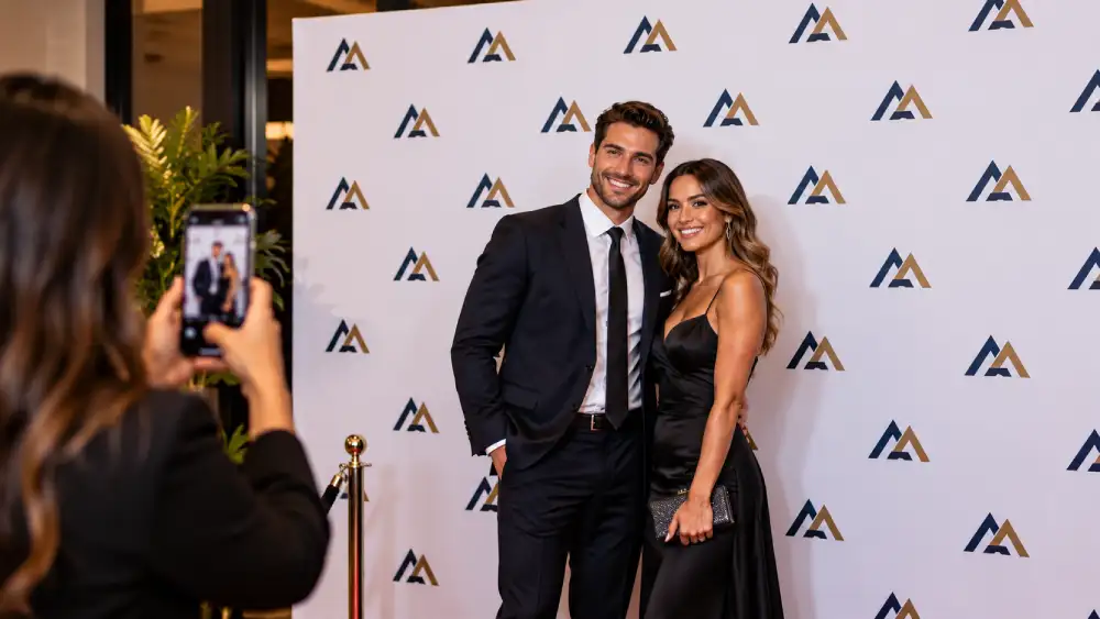 Logo placement on a step and repeat backdrop for vertical phone photos.