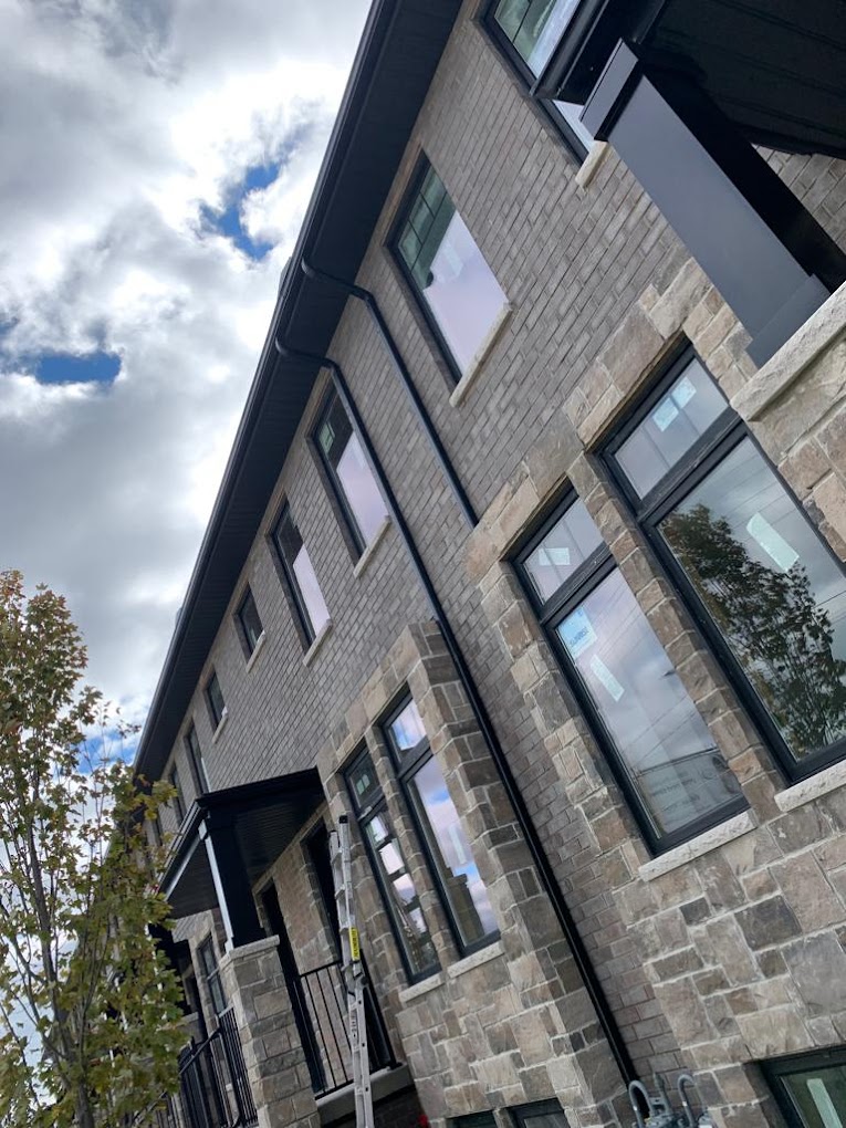 Modern Burlington home exterior with custom siding, gutters, soffit, fascia, windows, and exterior finishes