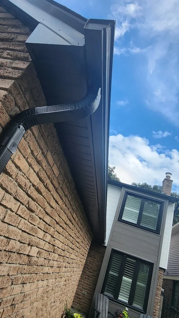 Downspout and exterior drainage installation by Infinity Gutters
