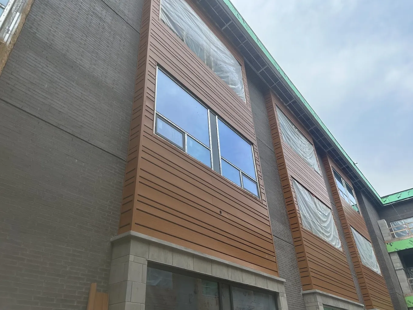 Toronto-area multi-unit exterior with new windows and coordinated exterior finishes
