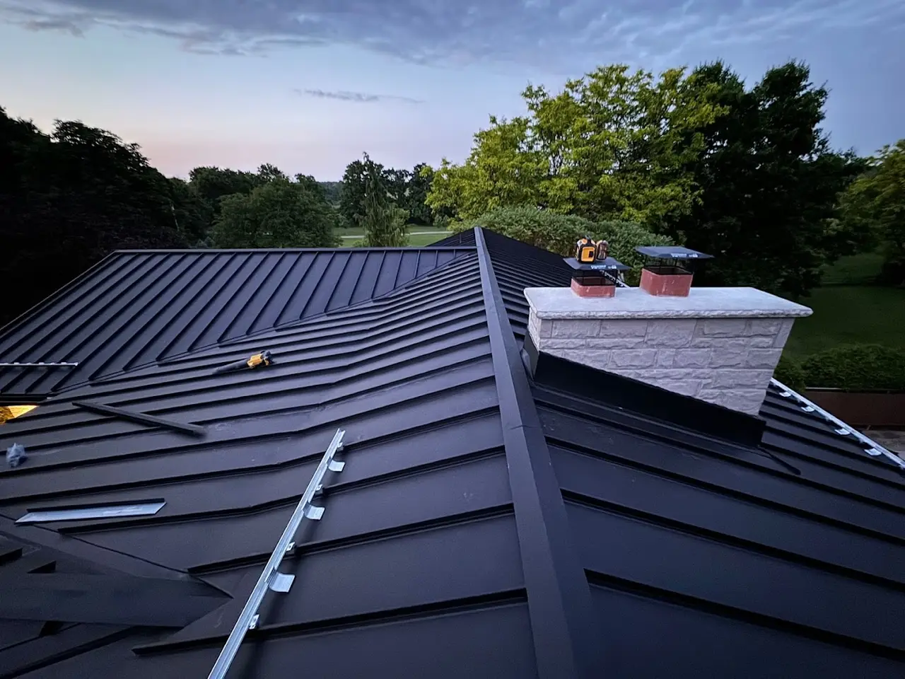 Standing-seam metal roof installation by Infinity Gutters & Exteriors in the Toronto area