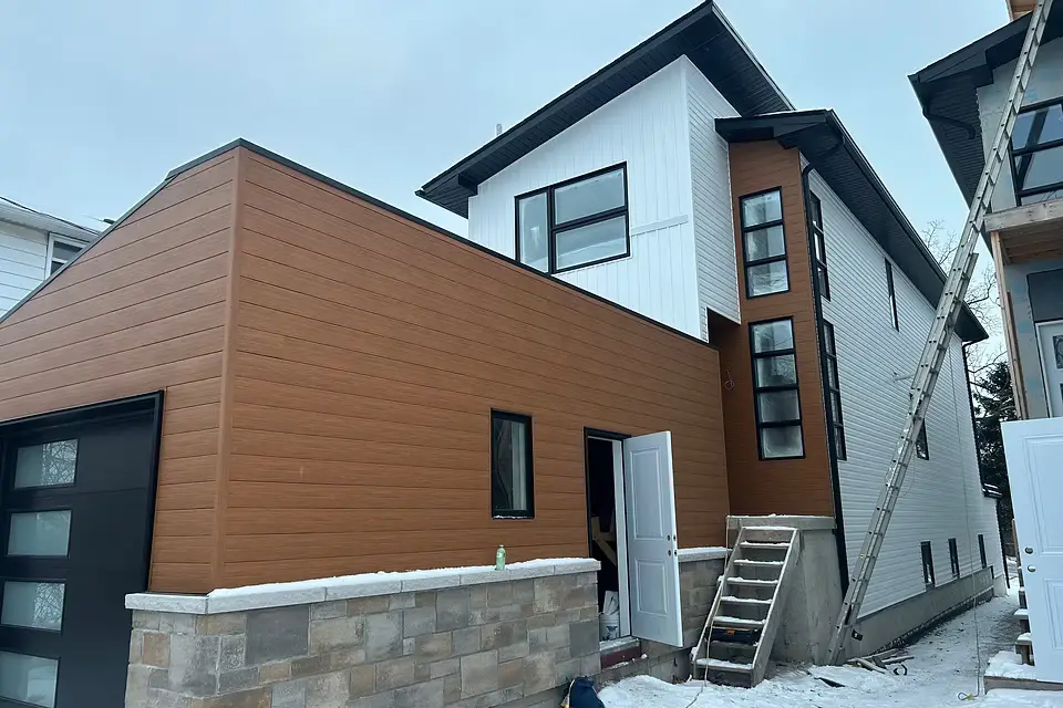 Modern Toronto-area home with wood-look siding and black exterior trim