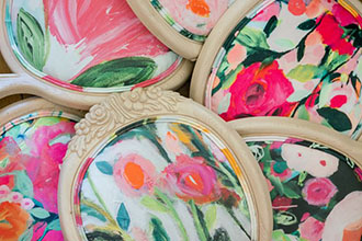 Chairs upholstered in bold painterly floral hero fabrics