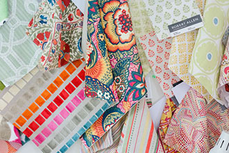 A mix of coordinated patterned fabric swatches