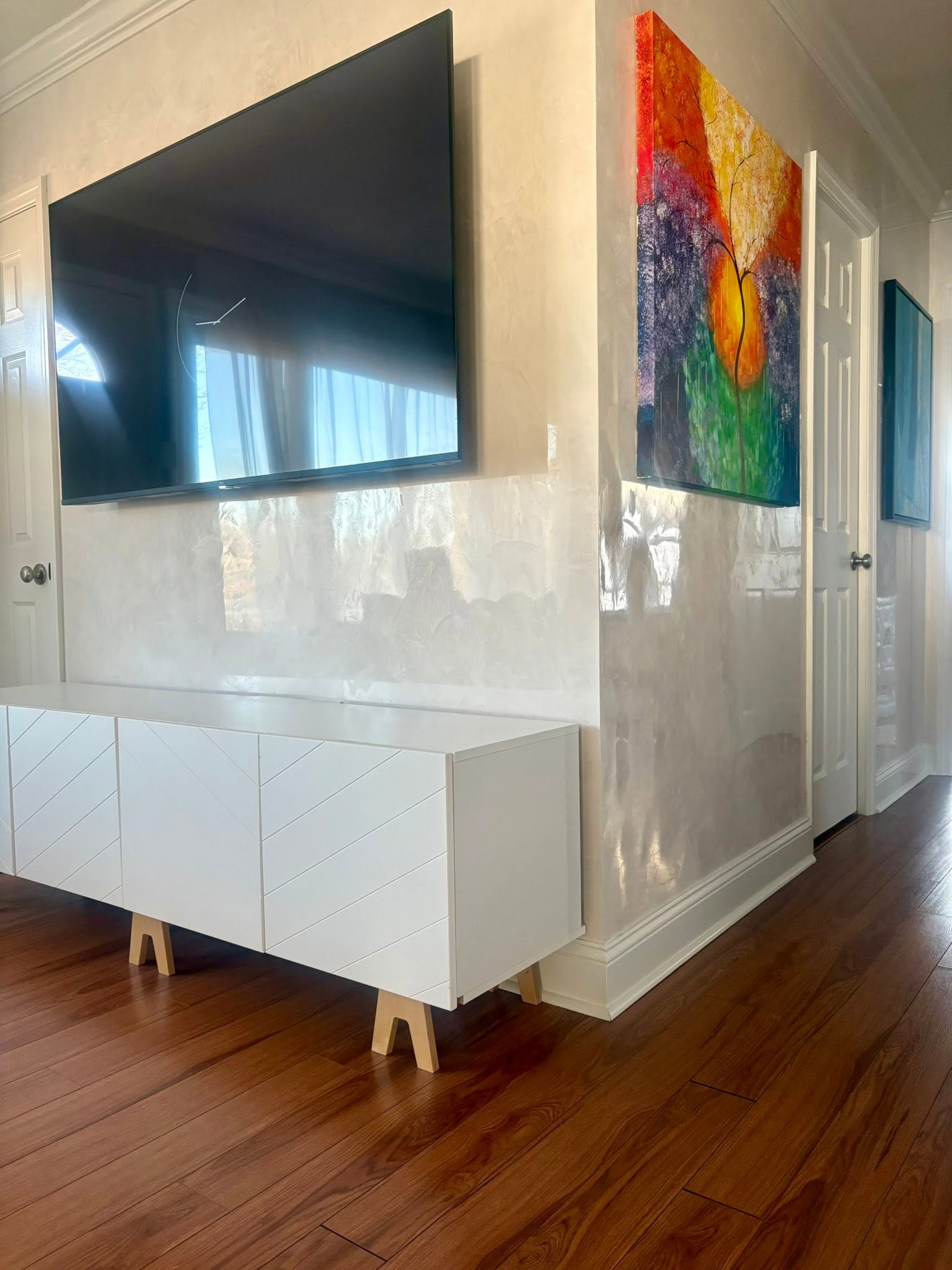 Polished Venetian plaster feature wall with luminous reflective finish in a modern St. Louis interior