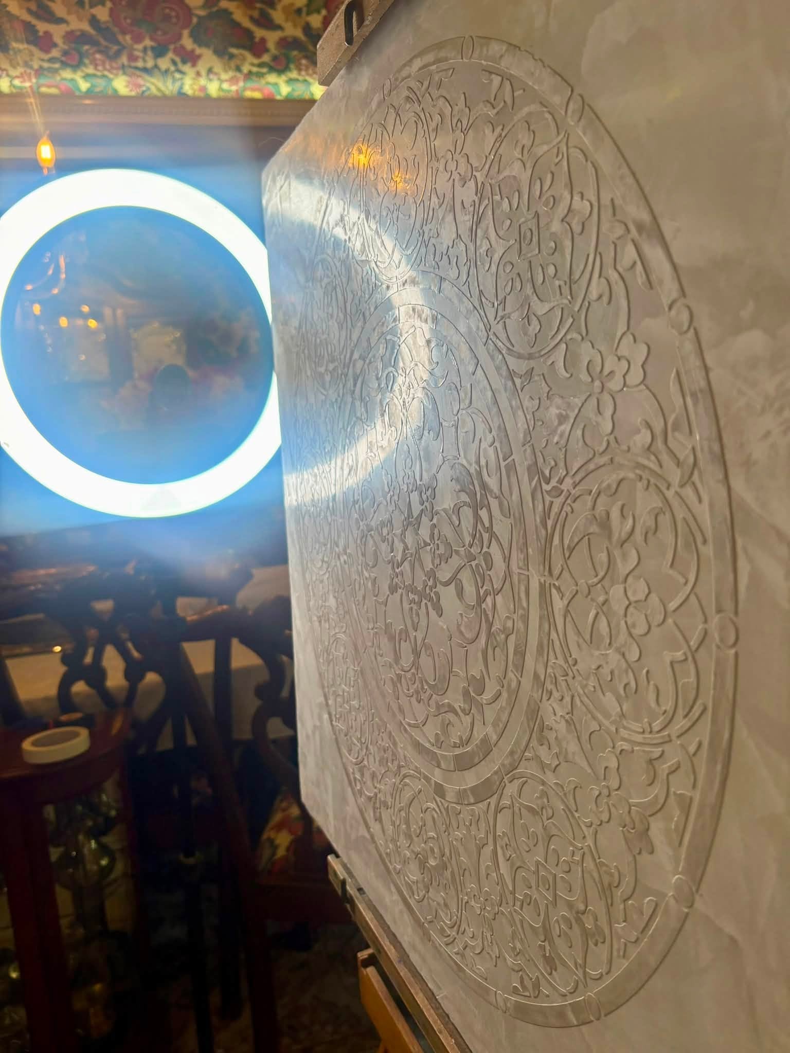 Handcrafted decorative plaster wall with raised ornamental detailing and polished finish