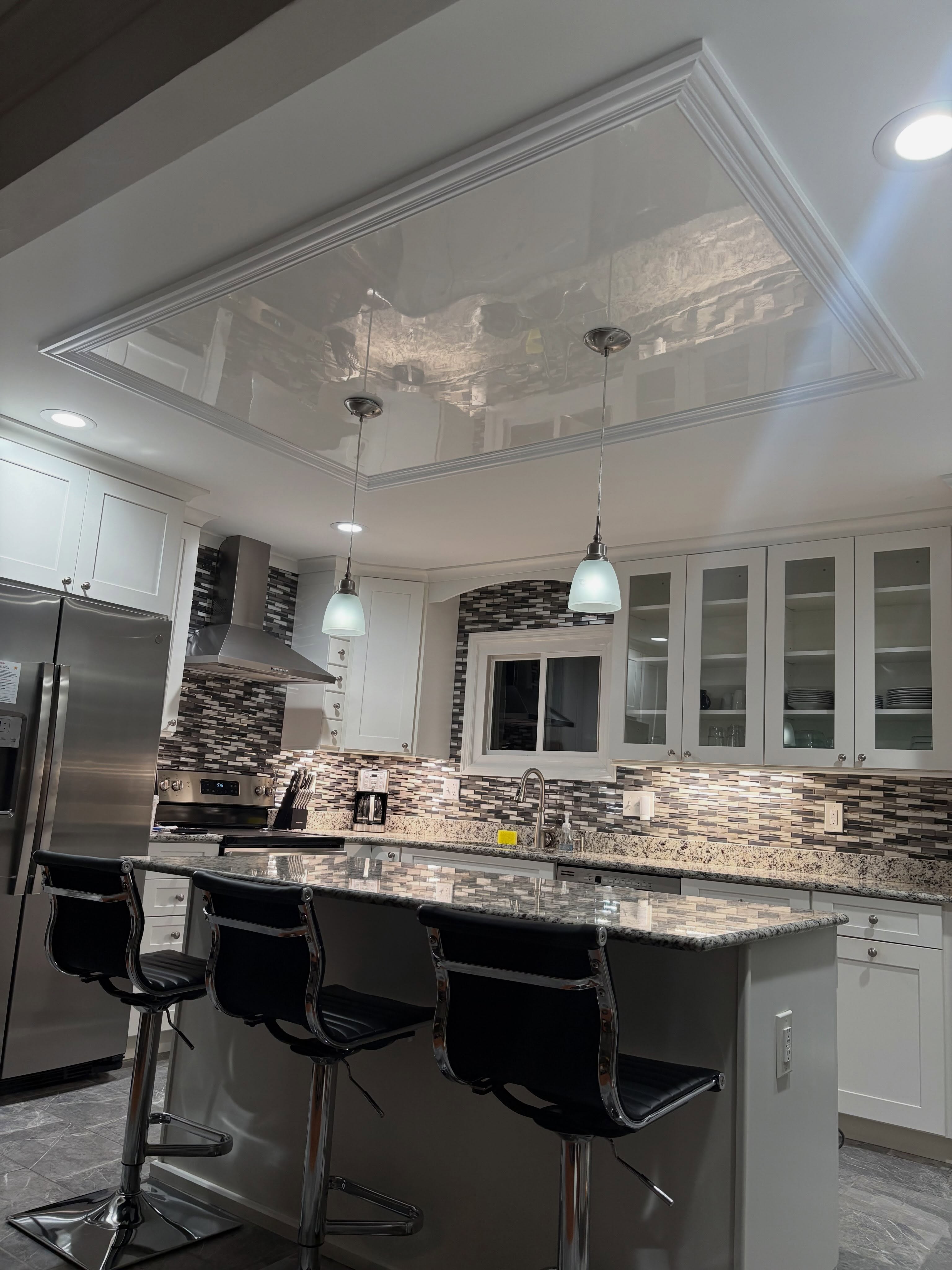High-gloss Venetian plaster ceiling with mirror-like finish in a luxury St. Louis kitchen