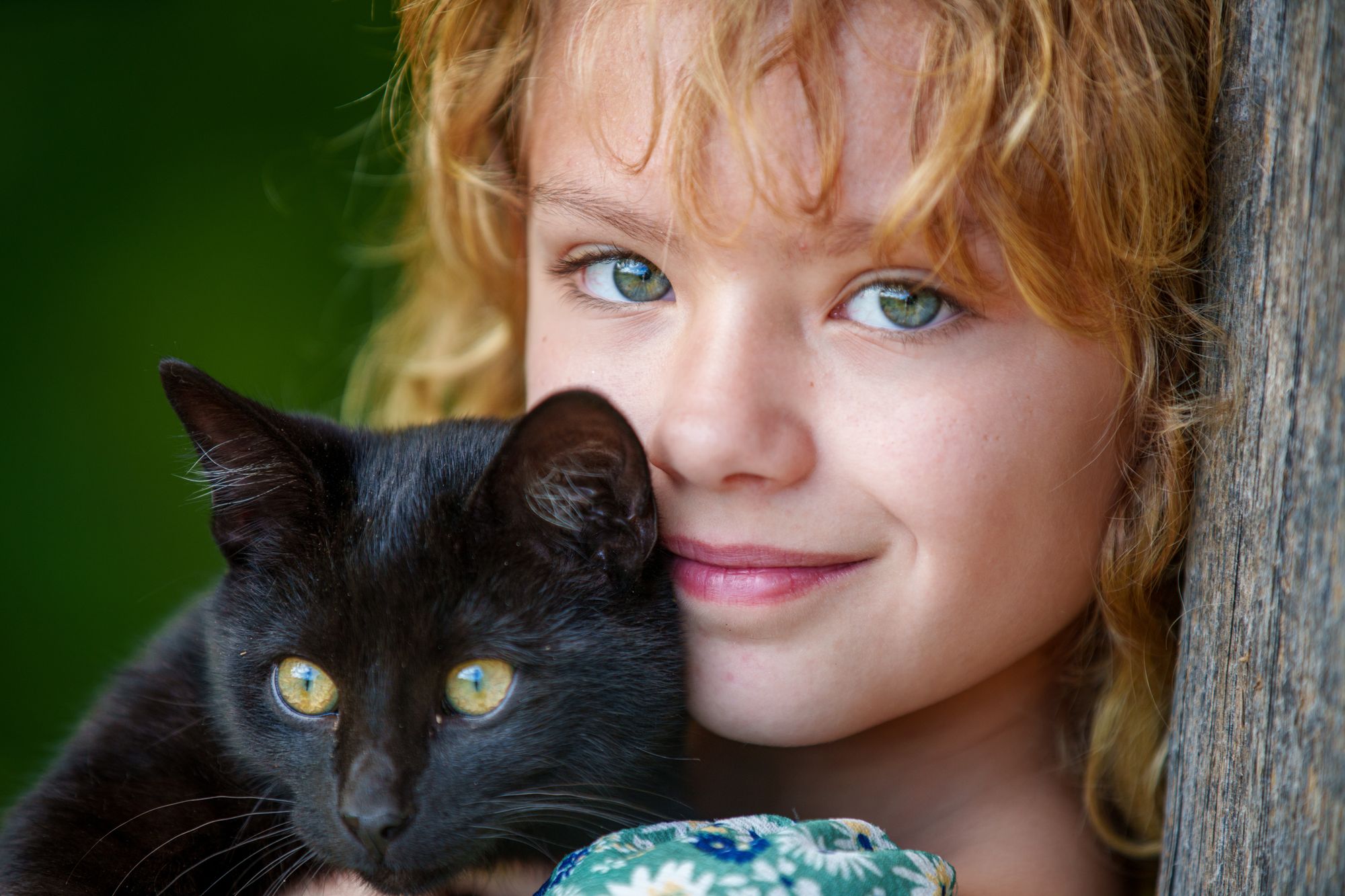 A girl with her cat in warm light