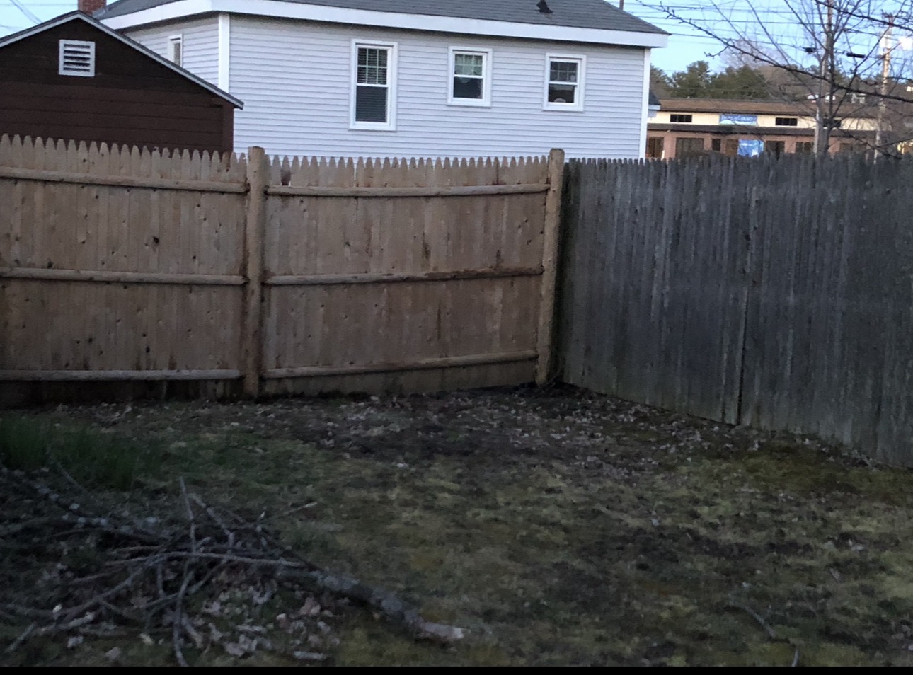 Fence installation — new section alongside existing fence