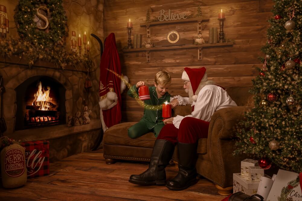 Child laughing with Santa in a quiet, warmly lit private studio