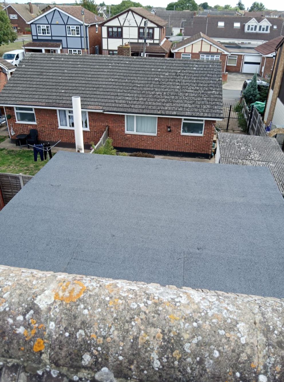 New grey felt flat roof on a garage