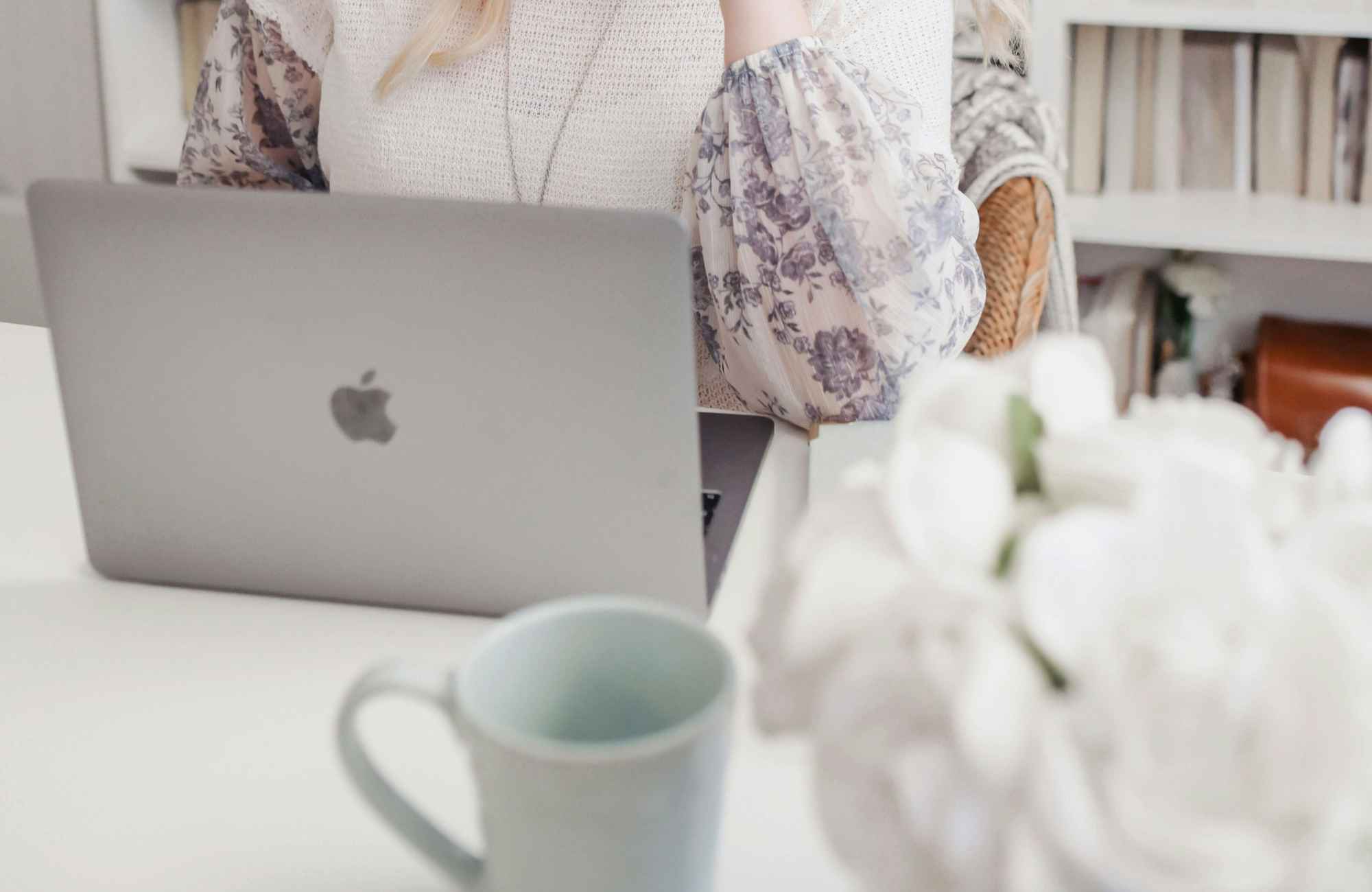 professional-home-organizer-sedona-az-time-saving-organizing-systems-woman-at-desk-on-computer-coffee-cup-peaceful-move-management