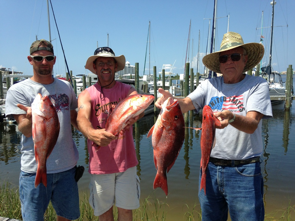 Group of anglers with a big catch on a Rising Son Expeditions charter near 30A