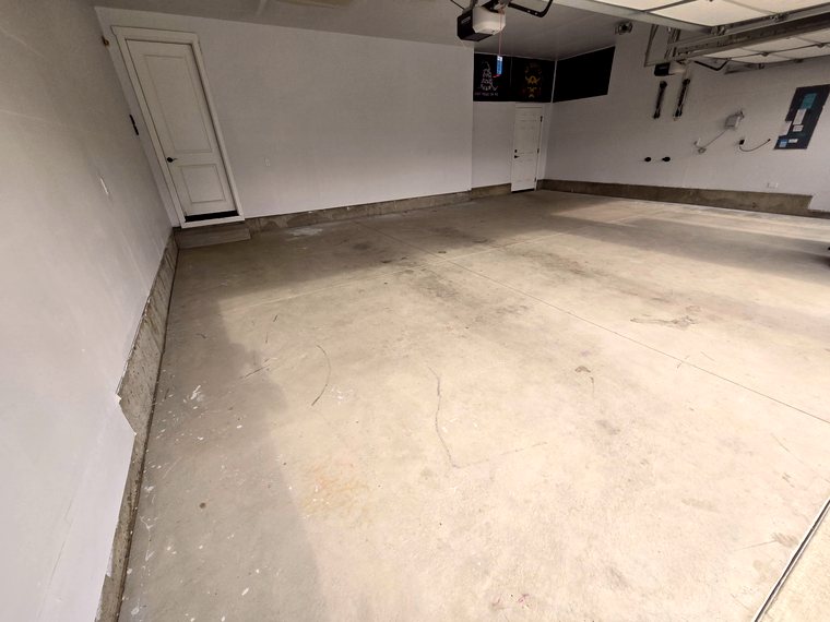 Bare concrete garage floor before coating