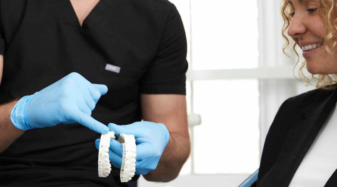 a ball with a smiley face surrounded by balls