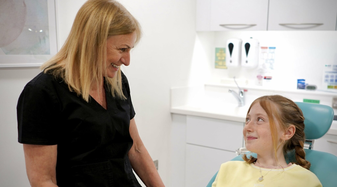 a ball with a smiley face surrounded by balls