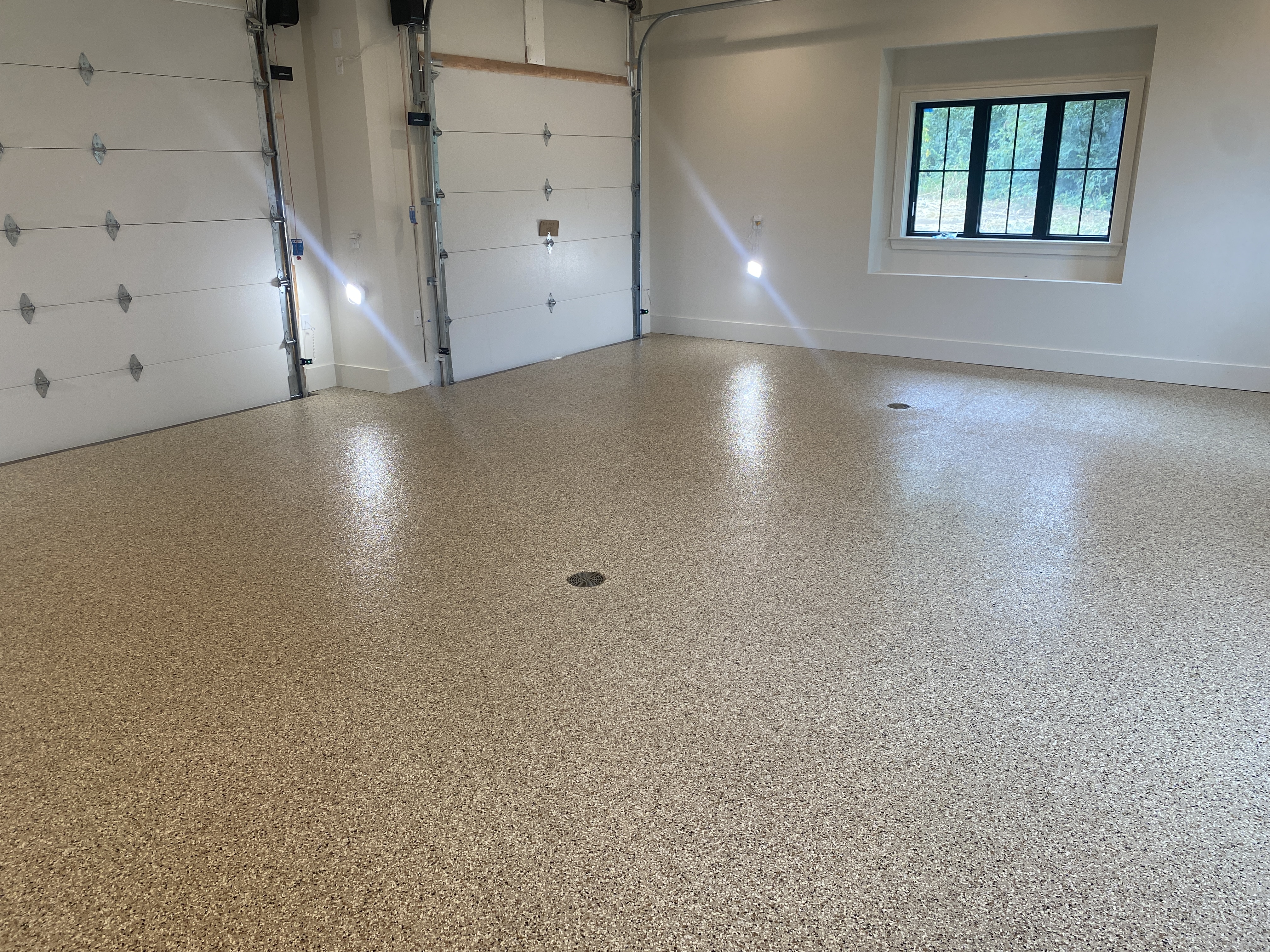 Polyaspartic topcoat seal and finish on Kansas City garage floor