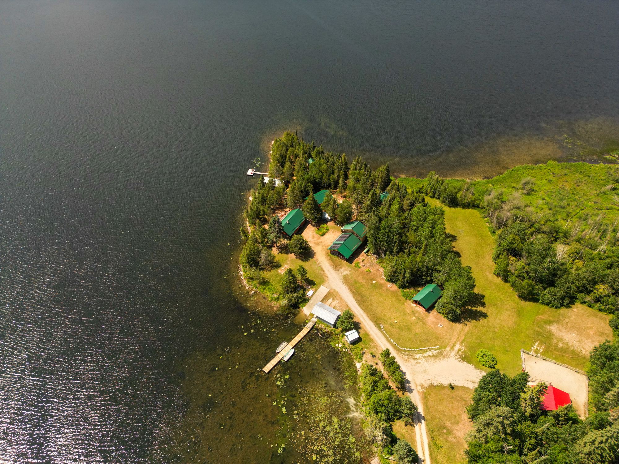 Aerial view of Wick Cliff Lodge with each cabin, the lake house and the wash house marked