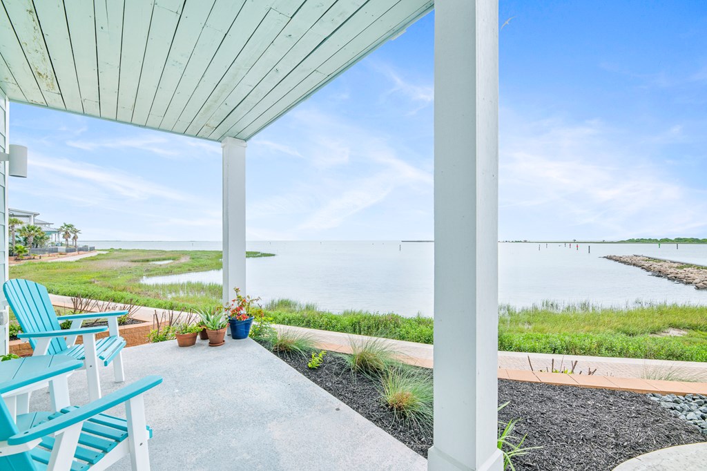 Elegant open-concept living room with panoramic bayfront views