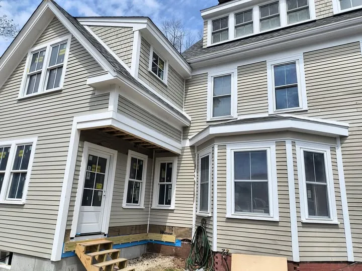 Completed siding project, exterior home detail, or siding/trim close-up