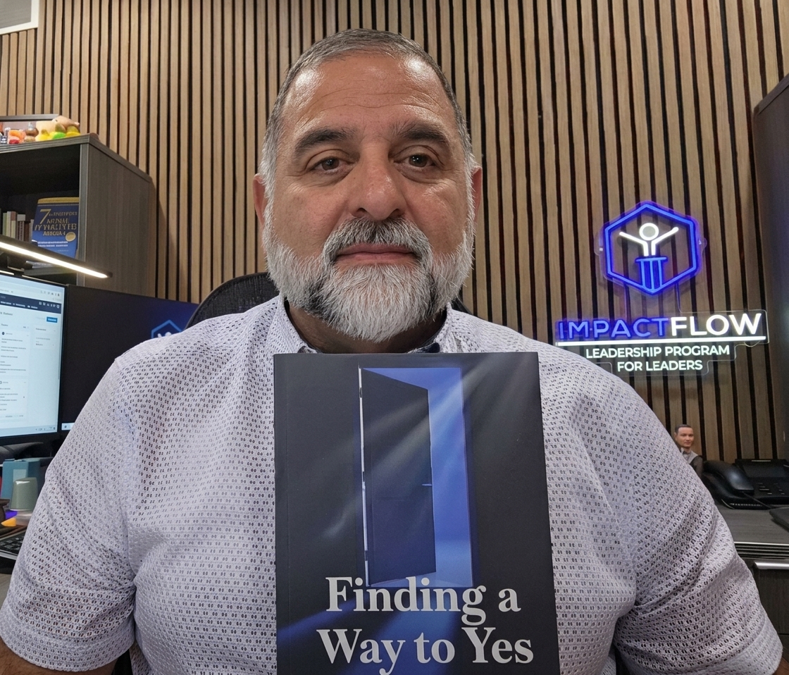 Author holding their published book