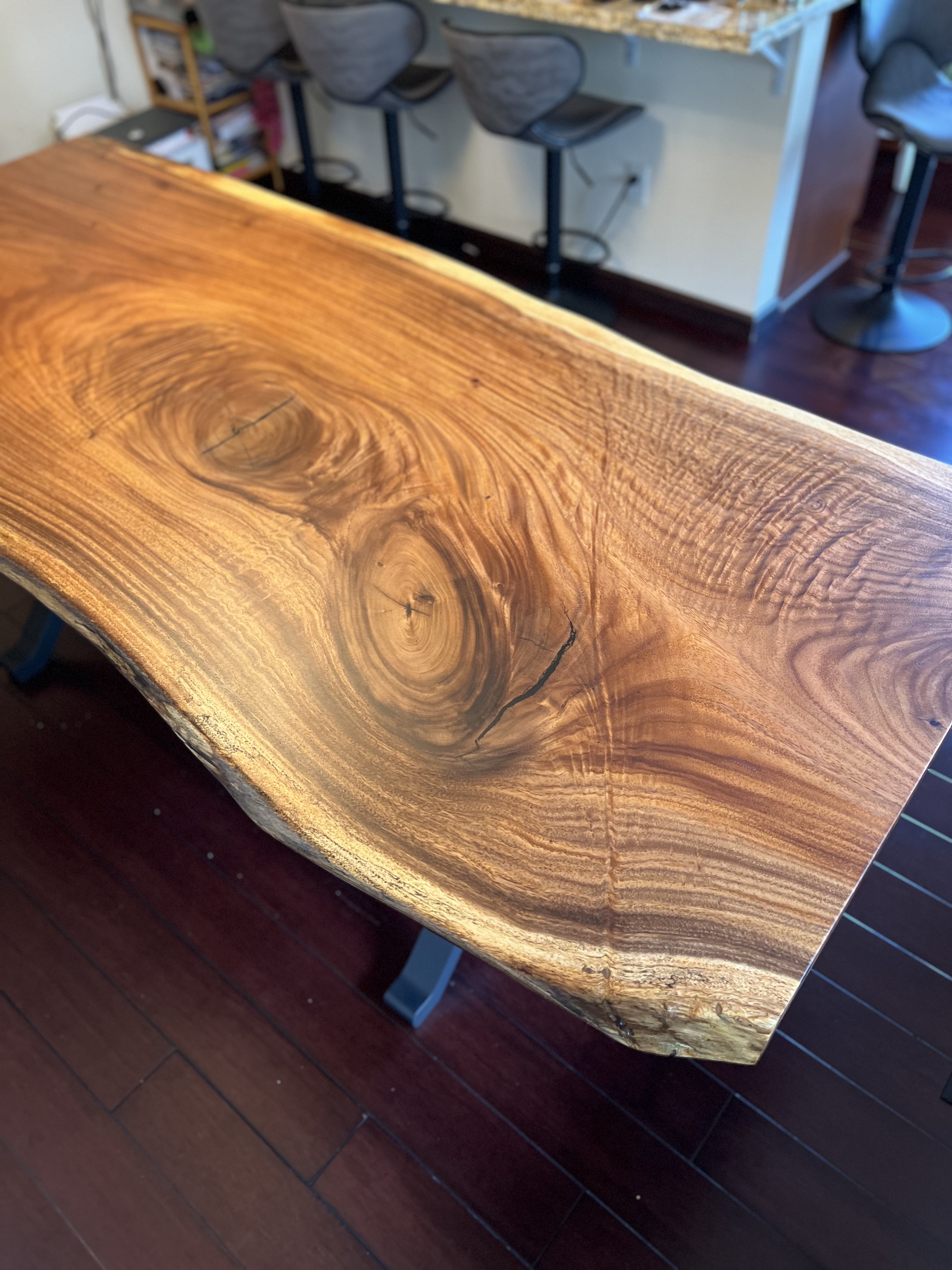 Close-up of a finished tabletop showing heavy grain figure