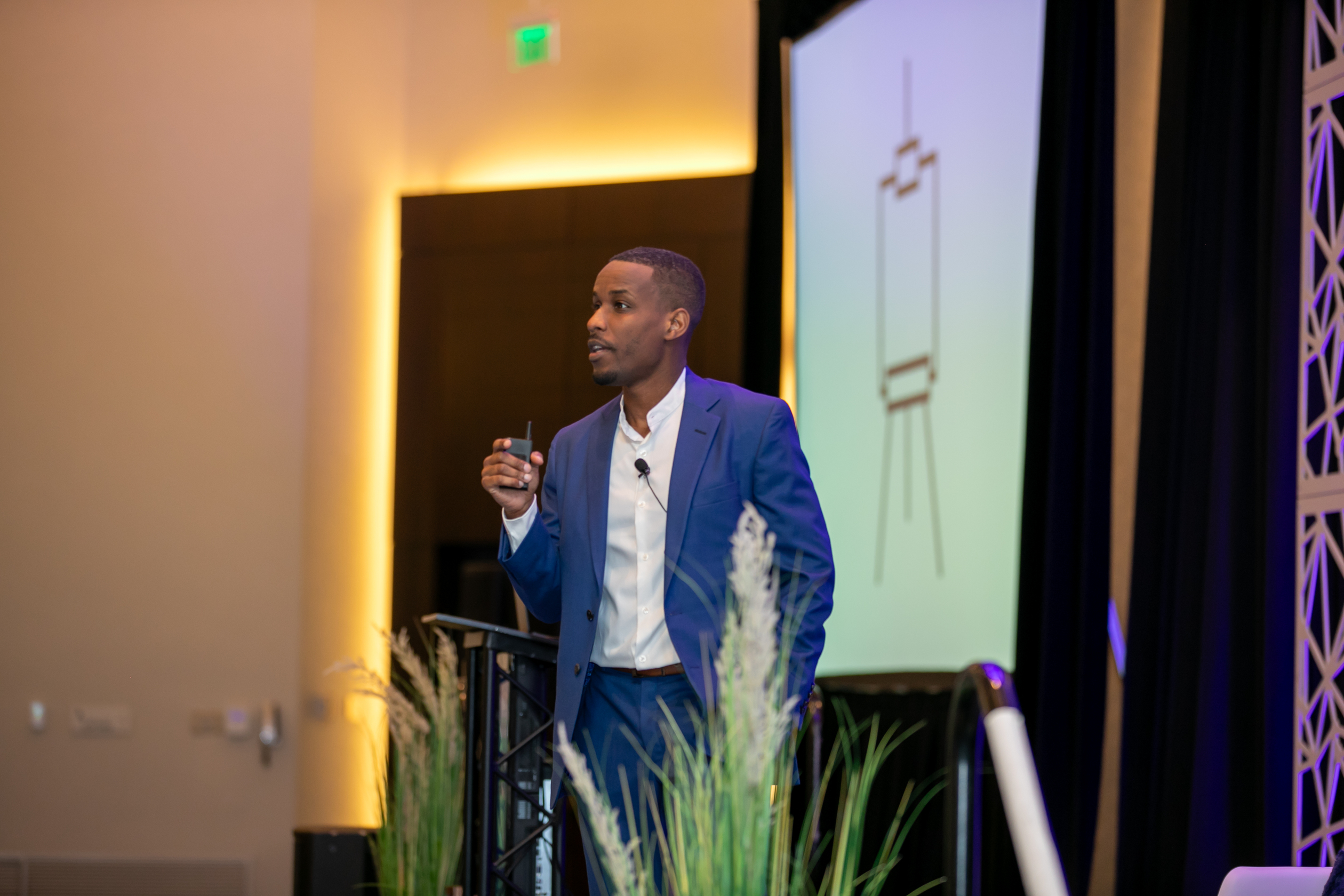 Joshua L. Washington speaking on stage
