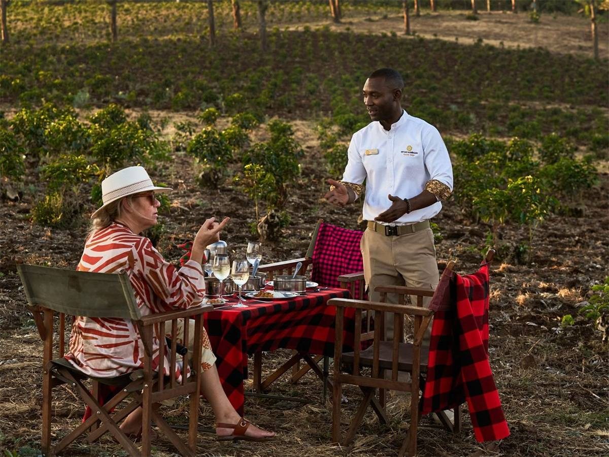 A candle-lit dinner table set against the crater highlands