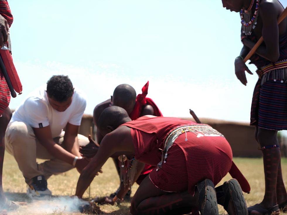 A highland Maasai boma with villagers gathered outside