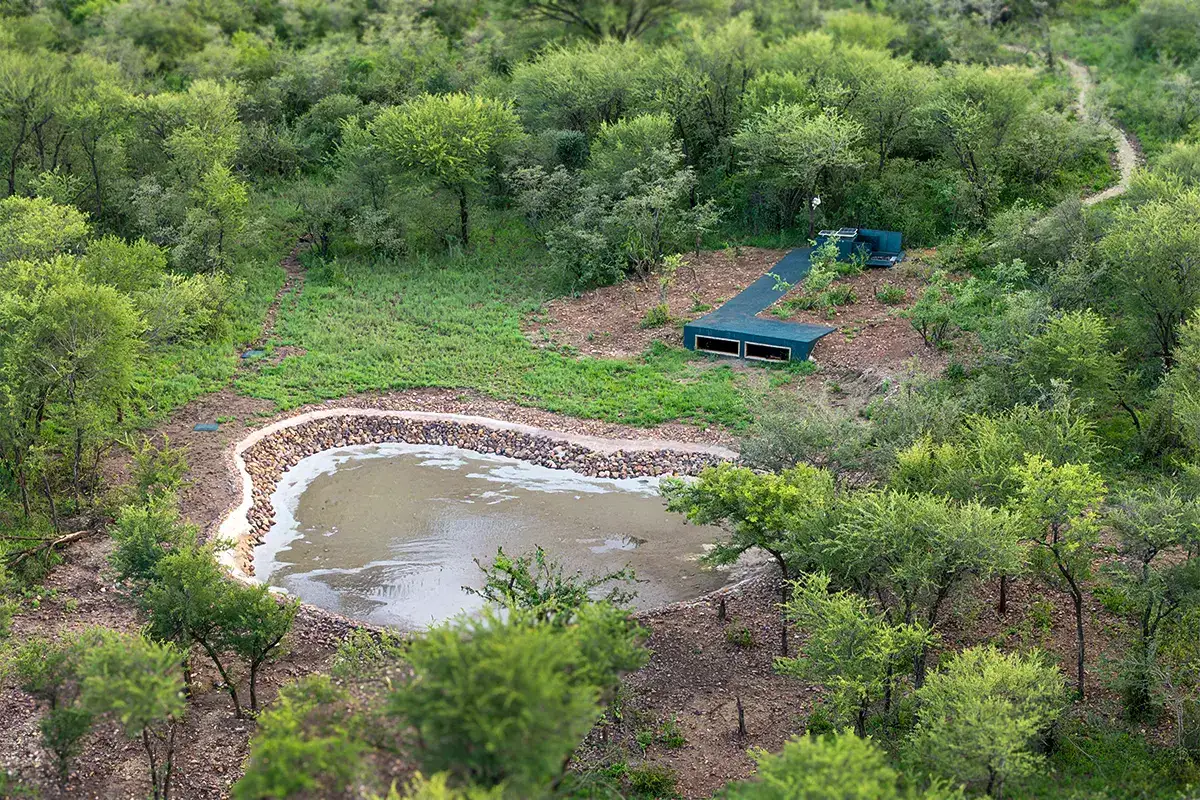 Aerial view of the sunken photo hide set beside its waterhole in the bush
