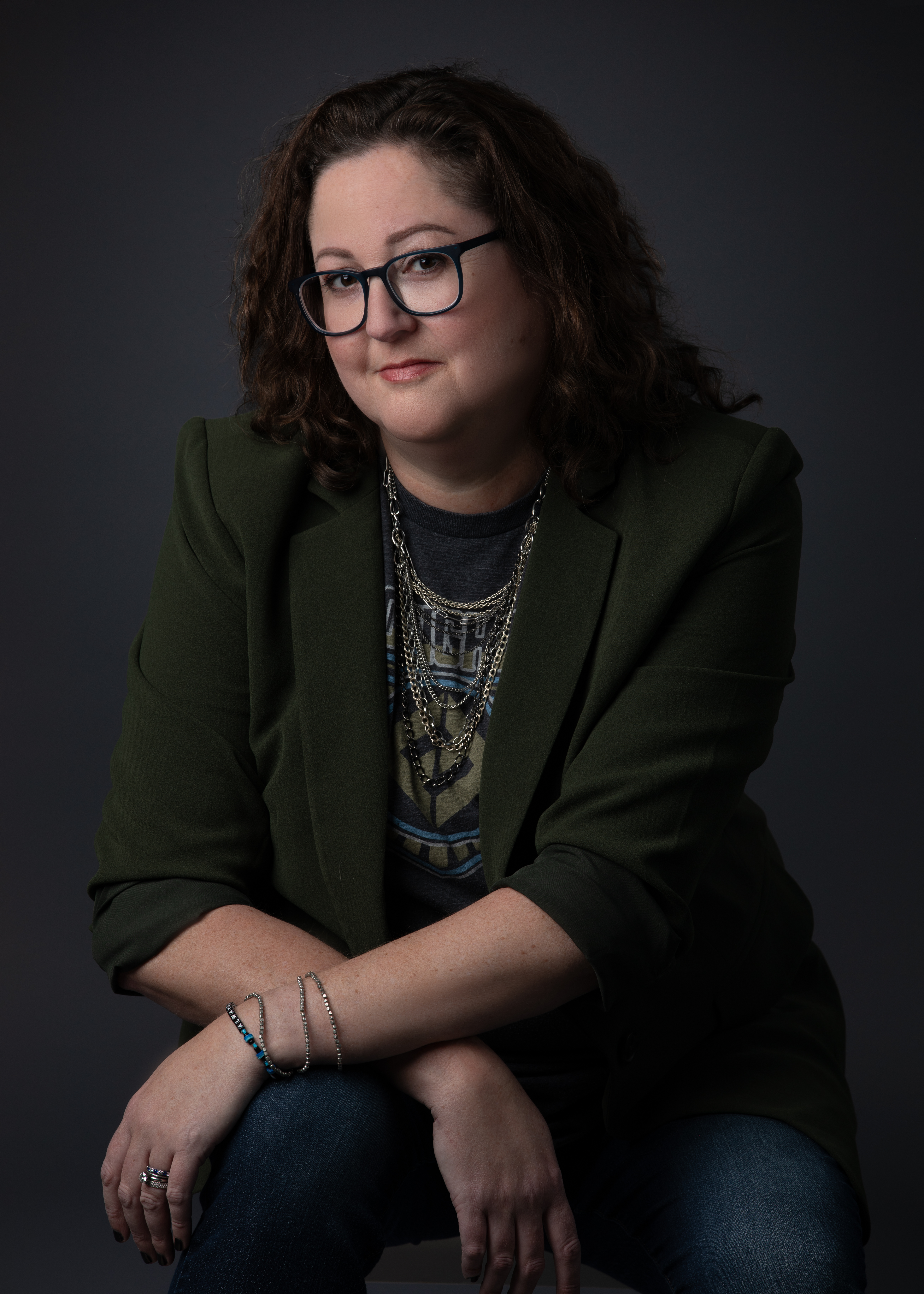 Teresa Kulupka — personal branding portrait, seated, arms crossed