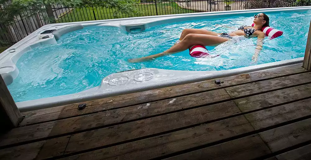 woman relax in swimlife swim spa