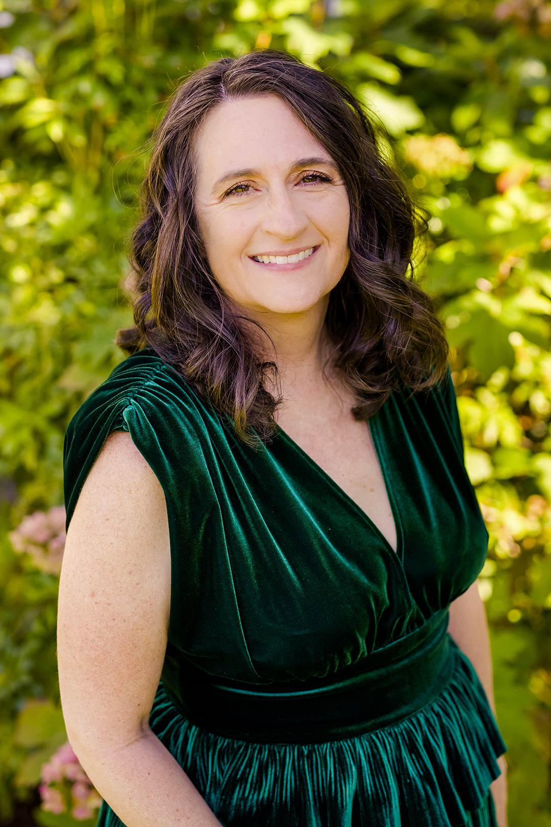 Adina in an emerald green dress. 