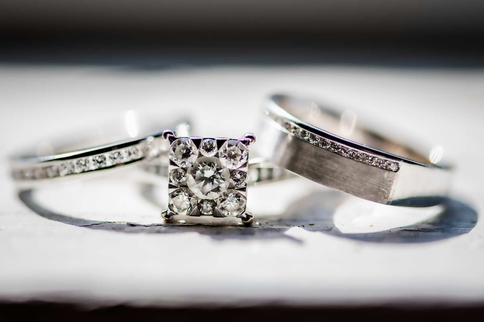 White gold wedding bands sitting on a window sill at TreeHouse Point