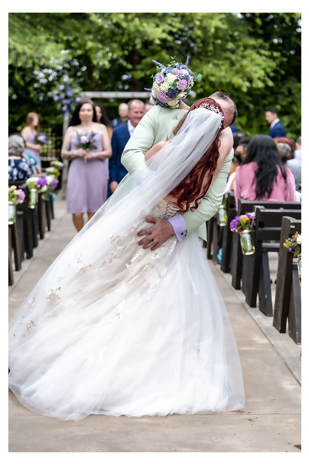 Groom dips bride back as they walk back down the aisle during the ceremony at Stocker Farms in Snohomish County.