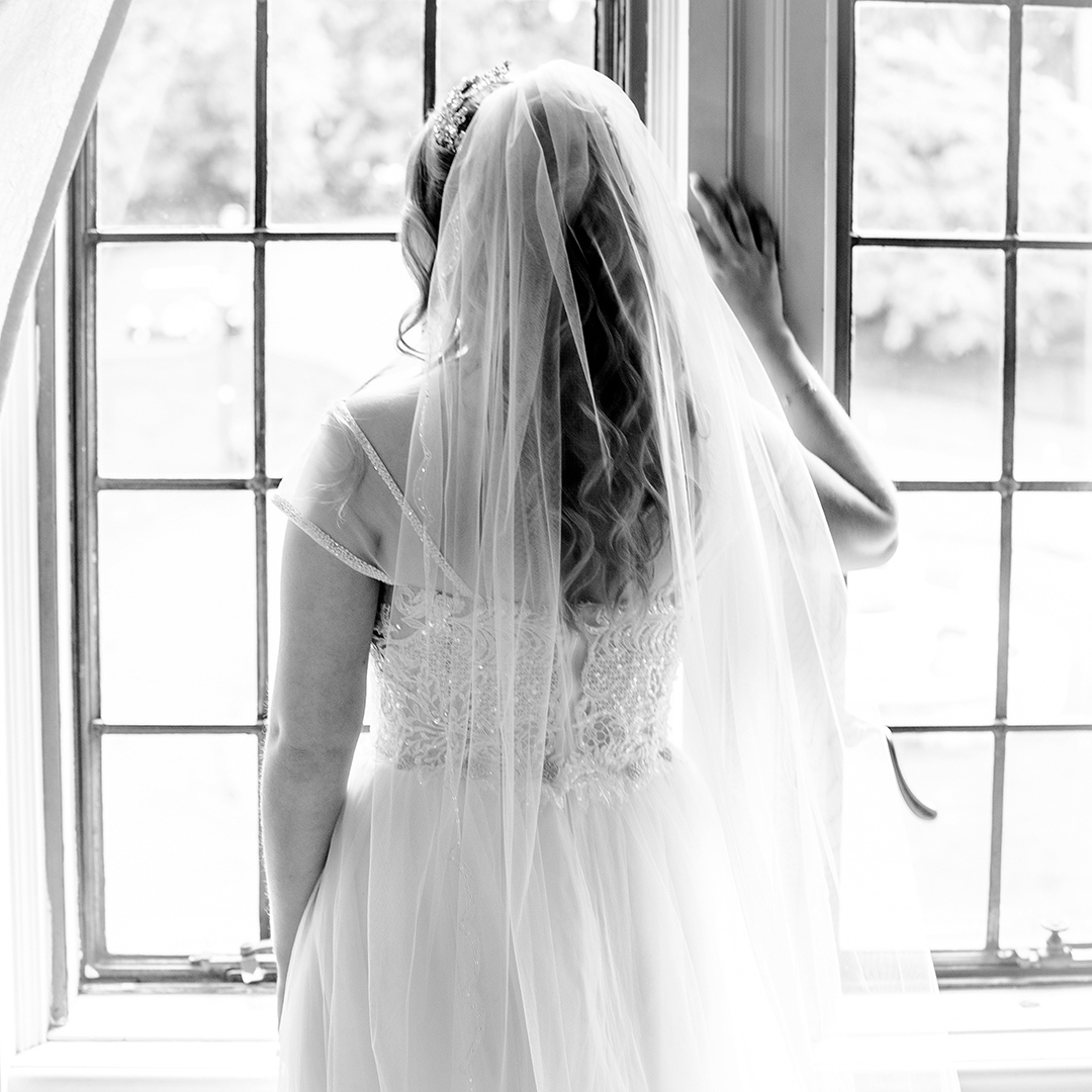 Bide looking out the window of the bridal suite.