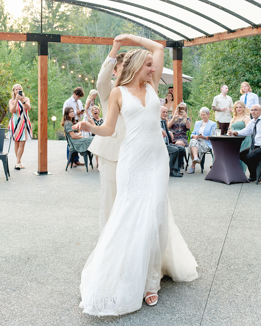 First dance. Groom spins bride on the dance floor. 