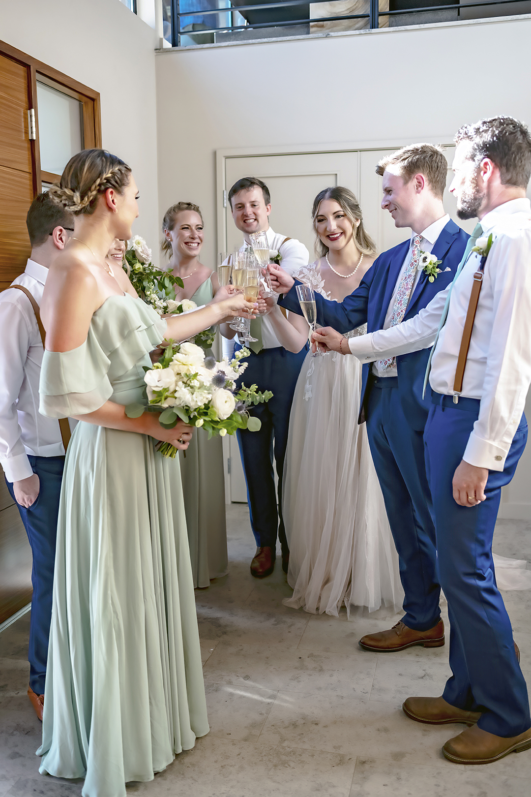 Cocktail hour toast with wedding party.